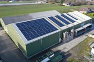 Flower bulb company with solar panels in a row on a roof. Photo